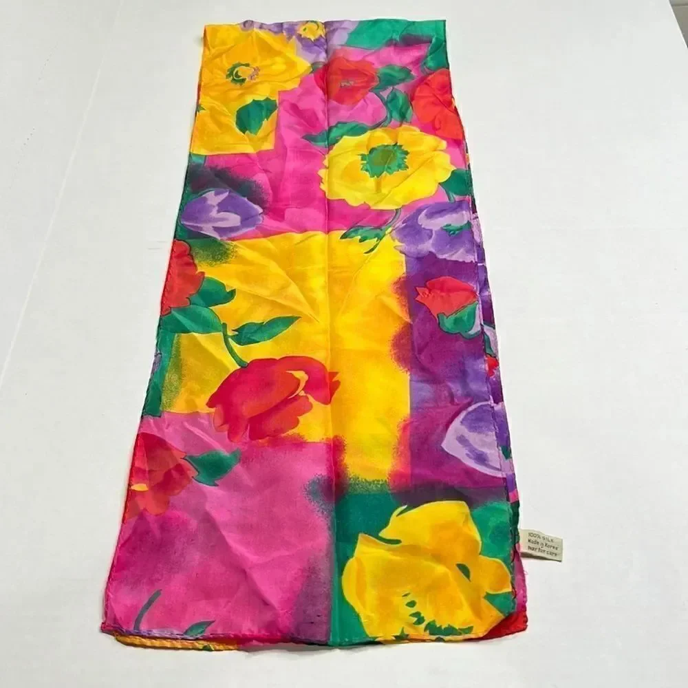 Vibrant floral silk scarf with gold purple pink and red flowers.
